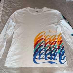 white and multi colored long sleeve coca-Cola long sleeve shirt